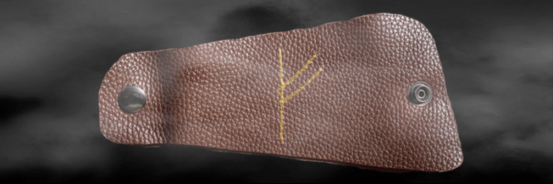 Руны Феху на коже как талисман удачи